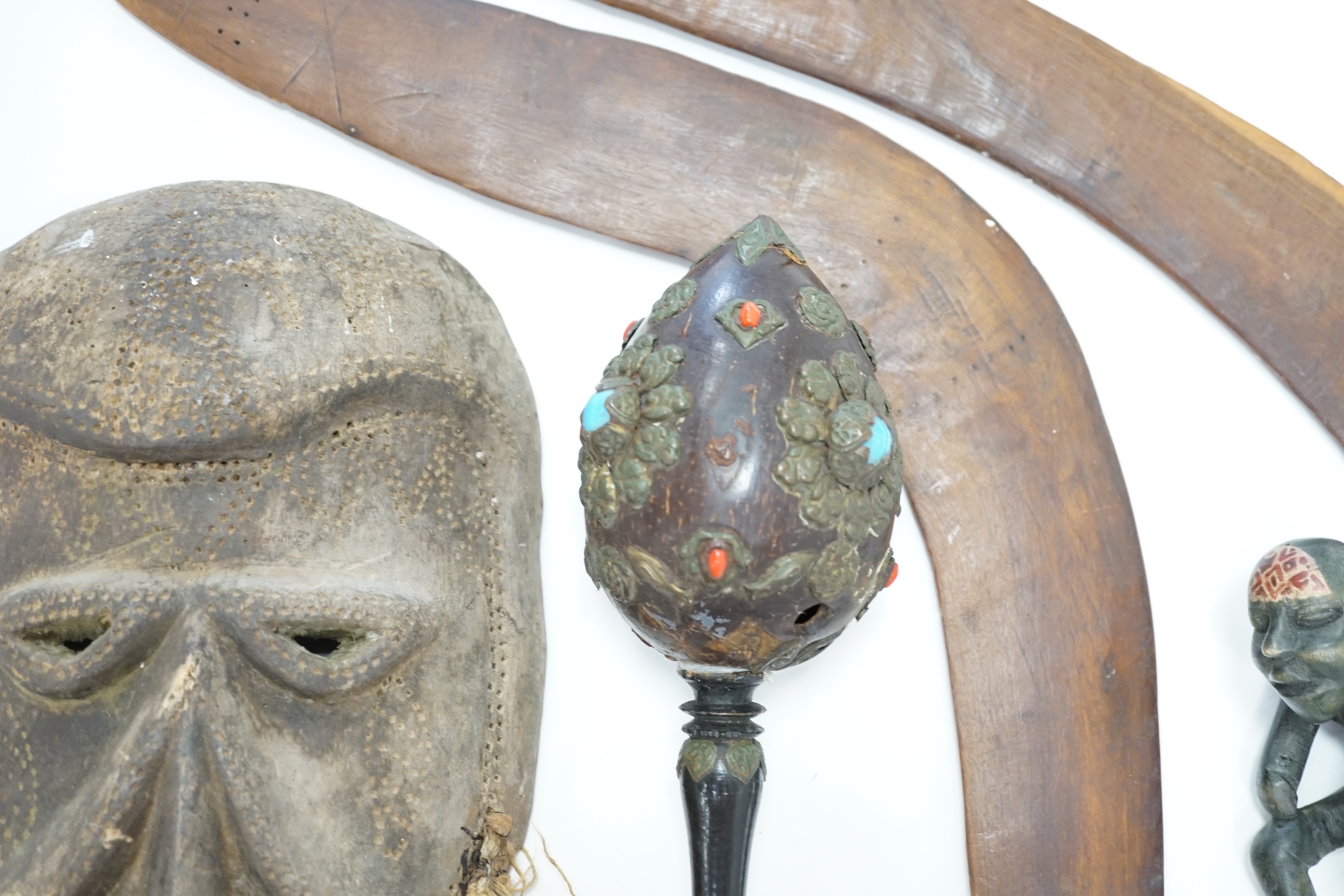 Two Aboriginal boomerangs, an African mask, a painted lion figure and four other items (8)